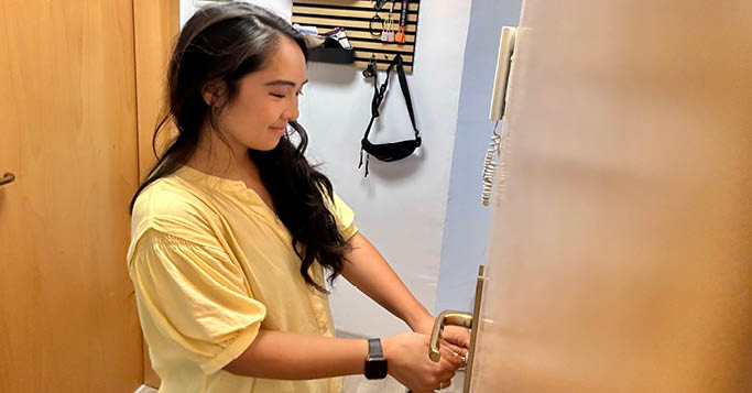 A woman locking her front door, representing the way European cloud providers safeguard data.