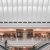 Mall or shopping center with high white ceiling and escalators